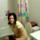 A somewhat homely looking girl is video-recorded by her boyfriend as she grunts & strains to take a shit. No audible pooping sounds in this brief clip.